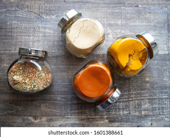 Bright Aromatic Spices In Glass Jars