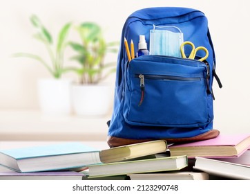 Bright Backpack On Table Home. School Supplies. Back To School Concept. Educational Design Objects.