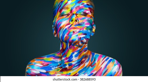 Bright beautiful girl with art colorful make-up and bodyart