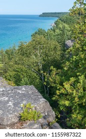Bright beautiful landscape of Niagara Escarpment limestone cliffs along the blue lake huron shore - Shutterstock ID 1155987322