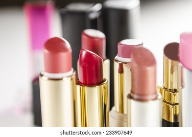 bright and beautiful lipsticks with lip tassel isolated on white background.