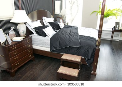 Bright Bedroom With A Queen Size Bed And Cupboard