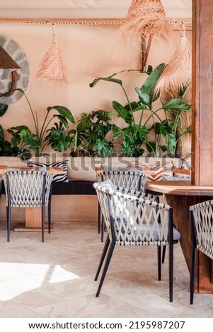 Bright beige bohemian interior in cafe by the beach in Spain in Marbella.