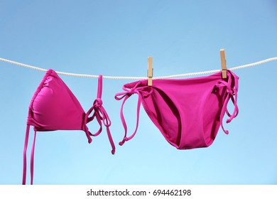 Bright Bikini Hanging On Rope Against Stock Photo (Edit Now) 694462198
