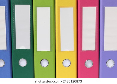 Bright binder office folders as background, closeup - Powered by Shutterstock