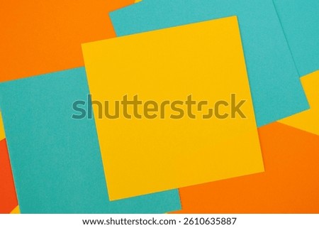 Bright blank memo square notes background. Blank yellow, orange, blue paper notes stickers in office.
