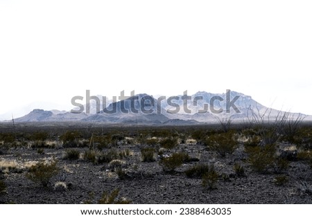 Bright Blown Out Sky Glows White Over The Chisos Mountains in Big Bend National Park