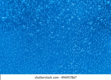 Bright blue background with hundreds of bubbles