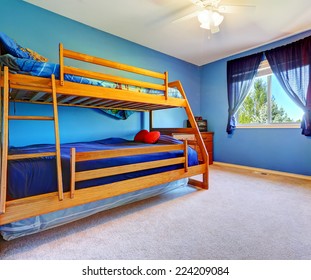 Bright Blue Bedroom For Kids With Wooden Bulk Bed And Nightstand