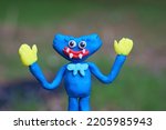 A bright blue monster made of plasticine. A character for children. Ideas for Halloween.