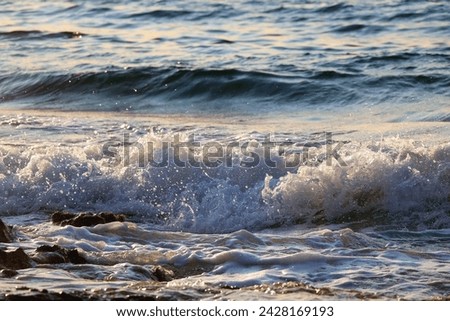 Similar – waves and splashes of sea surf and stones on the seashore in Egypt Dahab South Sinai