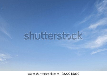 Bright Blue Sky Background With Light Whispy Clouds