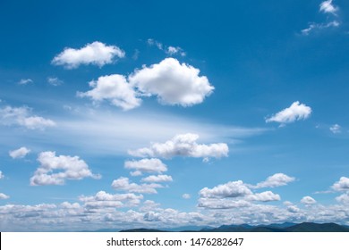 Bright blue sky background and white clouds group pattern floating with breeze  , summer day