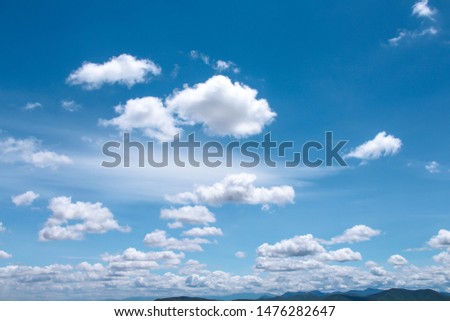 Bright blue sky background and white clouds group pattern floating with breeze  , summer day