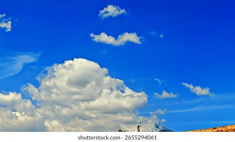 Bright blue sky with clouds.