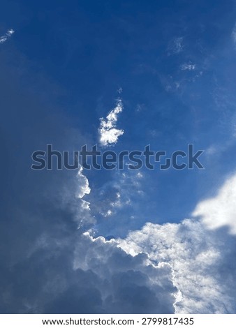Bright Blue Sky with Dramatic White Clouds and Natural Sunlight