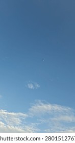 Bright blue sky at evening June,clear,soft cloud,breeze,scorching day.