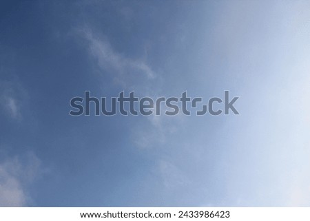Bright blue sky with feather clouds. Spring backgrounds