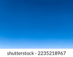 Bright blue sky gradient background. Clear empty sky texture, blank skyscape poster with no clouds. Cloudless empty sky. Natural background of the blue sky