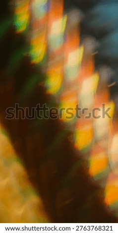 Bright blur prism. Reflection glow. Color striped light on black background. Vibrant abstract fractal yellow orange night luminosity.