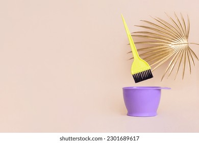 Bright bowl hair coloring brush palm leaf. Background for hair salon designs with copy space. Hairdressing accessories in minimalist style - Powered by Shutterstock