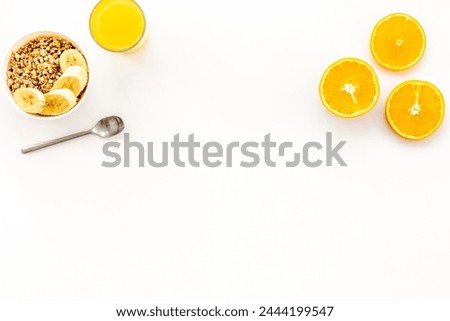 Bright breakfast with granola and orange juice on white table background top view mockup