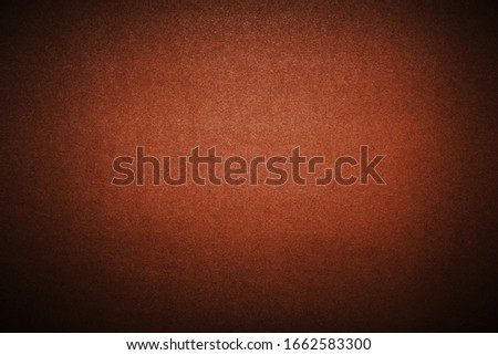 Bright brown background with vignetting. The texture of the cardboard
