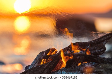 Bright Campfire On The Beach In Evening