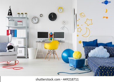 Bright Child Room With Bed, Chairs, Desk And Interesting Stickers On The Wall