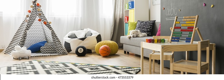 Bright Child Room Interior With Couch, Bean Bag Chair And Small Teepee