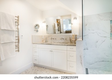 Bright And Clean White Bathroom With Subway Tile Glass Shower And Claw Footed Bathtub