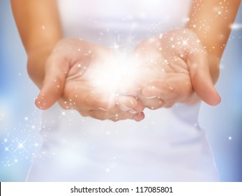 Bright Closeup Picture Of Magic Twinkles On Female Hands