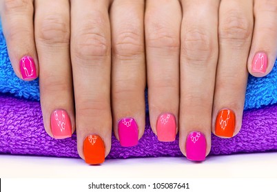 Bright color manicure on a bright background