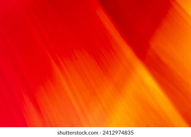 Bright colored blurry strokes and waves in the form of red and orange lines. Abstract background. Place for copy space. Backdrop