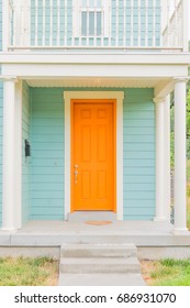 Bright Colored Front Door Of Remodeled Urban Home, Tangerine Orange And Light Turquoise Baby Blue