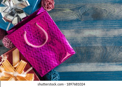 bright colored gift boxes with bow packages on wooden background kopi space holiday concept