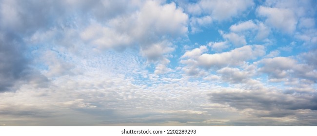 Bright colored idyllic cloudy sky at the horizon. Aerial panoramic view for natural texture and background - Shutterstock ID 2202289293