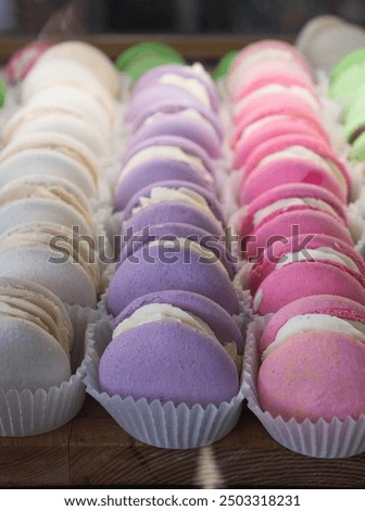 bright colored macaroons with different flavors, lots of macaroons
