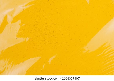 Bright colored transparent gift box. Glitter paper under cellophane. Background with copy space or backdrop. Yellow - Powered by Shutterstock