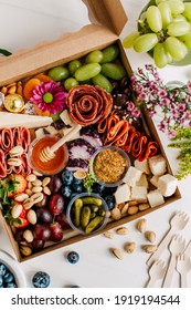 Bright And Colorful Charcuterie Boards And Boxes Fruit, Meat And Cheese