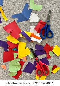 Bright Colorful Cut Construction Paper Shapes And Child’s Safety Scissors For An Art History Lesson In A Preschool Classroom