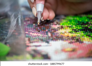 Bright and colorful diamond painting closeup with backlight