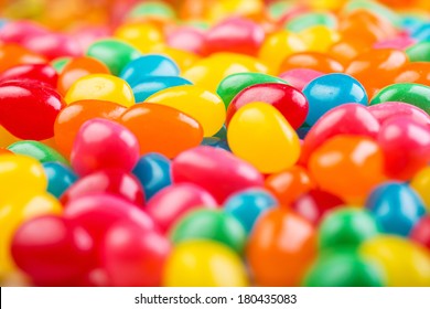 Bright, Colorful Jellybeans In Red, Green, Pink, Blue, Yellow And Orange Colors.