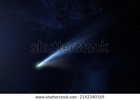 A bright comet with large dust and gas tails. Falling meteorite, asteroid, comet in the starry sky. Sci-fi background. Elements of this image furnished by NASA. 