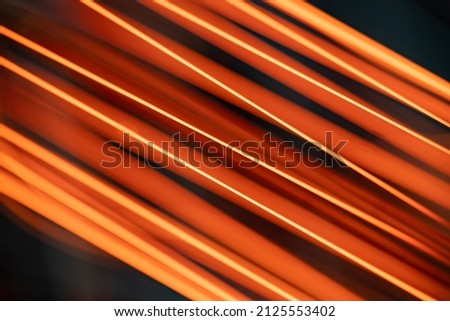 Bright dark red-orange background in fiery and fiery stripes with an abstract pattern