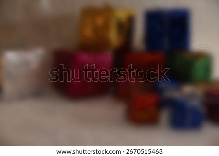 Bright decorative gift boxes in various colors with shiny ribbons, festive arrangement for decoration and themed events