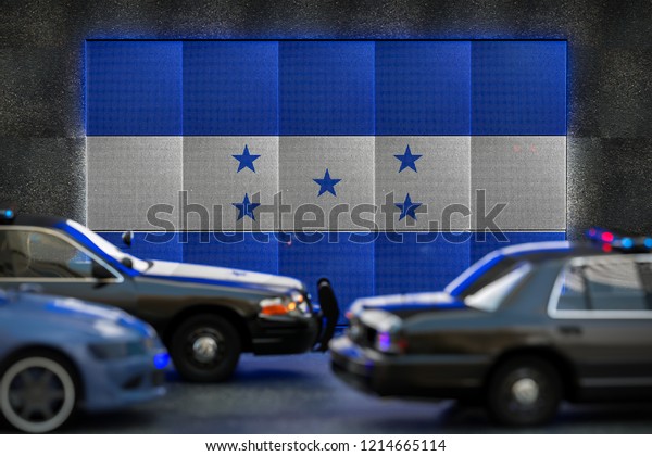 Bright digital display Honduras flag in city as cars\
drive past