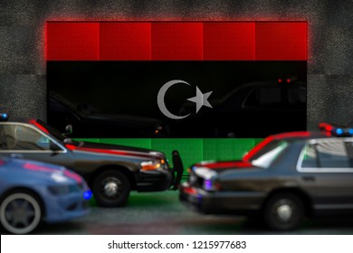Bright digital display Libya flag in city as cars drive past