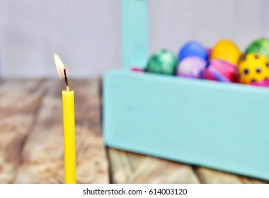 Bright Easter eggs in a colored basket. Testicles in a wooden box. The painted Easter eggs on a virgin background. color easter egg