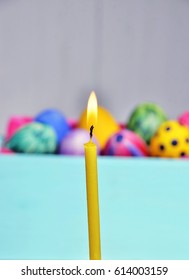 Bright Easter eggs in a colored basket. Testicles in a wooden box. The painted Easter eggs on a virgin background. color easter egg